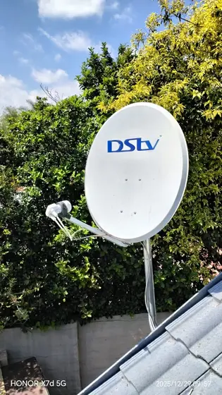DStv dish aligned and sealed on a tile roof