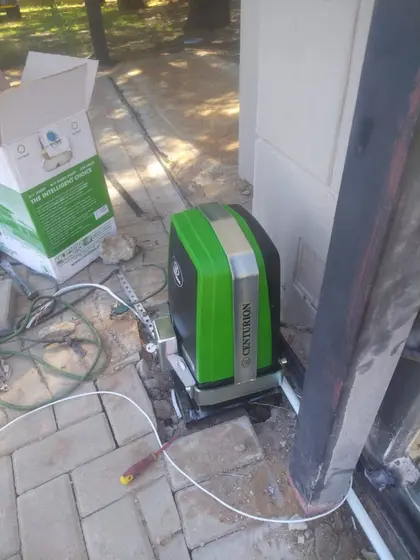 Centurion sliding gate motor installed at a driveway