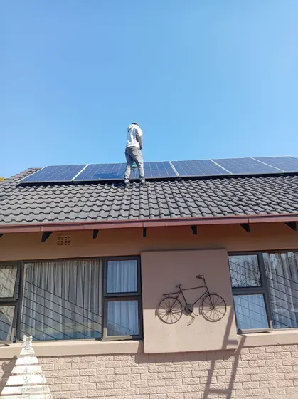 Solar panels being installed on a residential roof